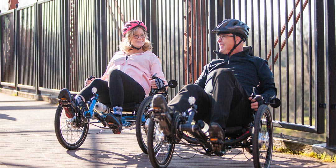 recumbent trike riders on the american river bridge