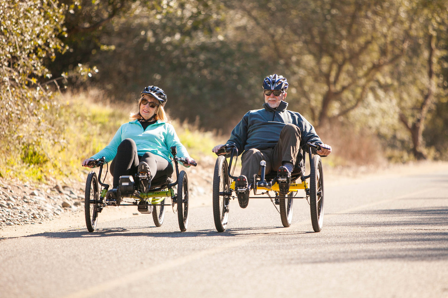 Older couple riding recumbent trikes on the American River Bike Trail