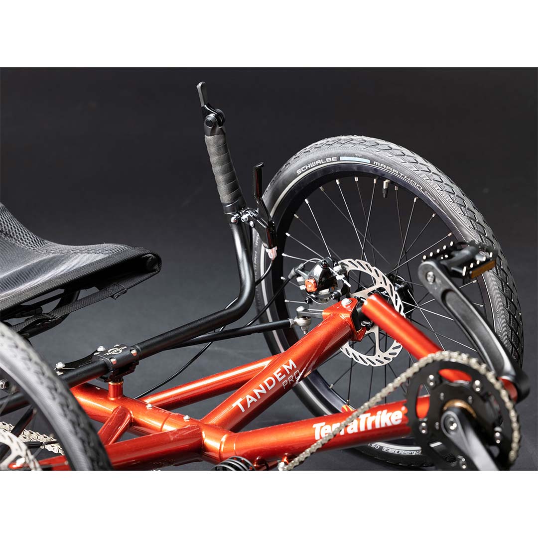 TerraTrike Tandem Pro left handle bar, wheel, and pedal close up