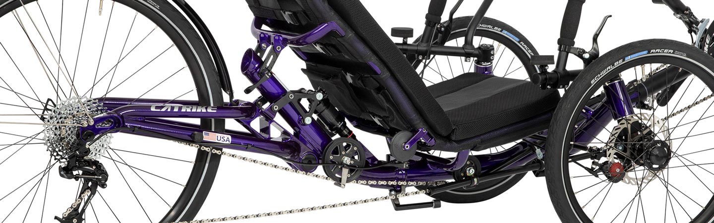 Side view of the rear suspension on a purple Catrike Dumont
