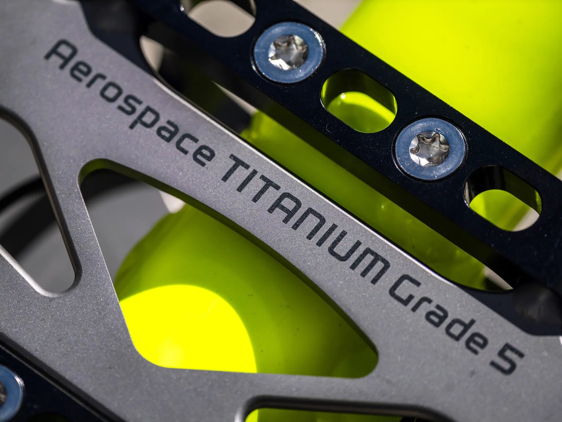 AZUB Ti-FLY 26 aerospace-grade titanium suspension arm, laser-etched Grade 5 detail