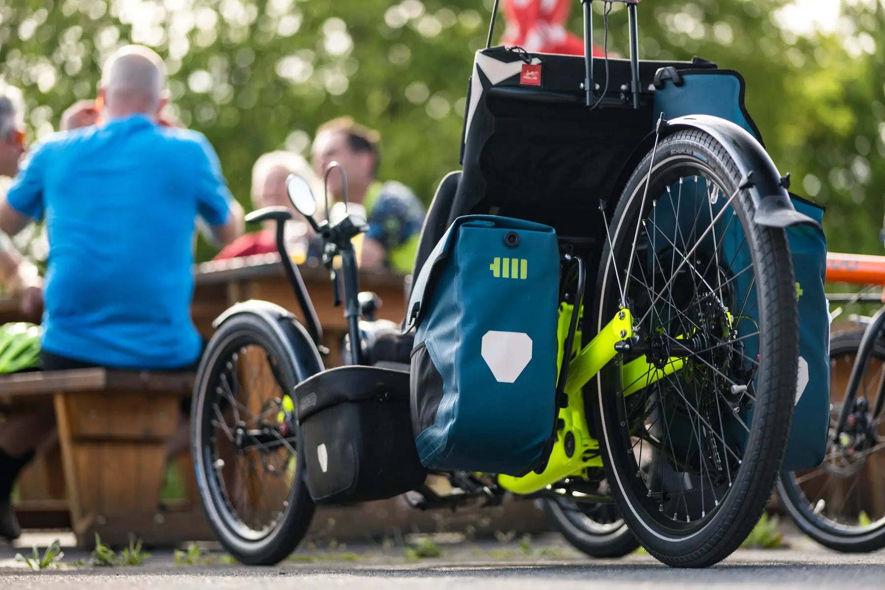AZUB Ti-FLY 26 recumbent trike rear three-quarter view with touring panniers