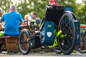 AZUB Ti-FLY 26 recumbent trike rear three-quarter view with touring panniers