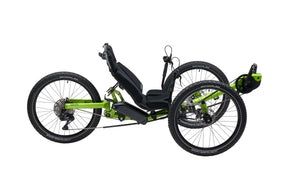 AZUB Ti-FLY X full-suspension recumbent trike, green, studio side profile showing drivetrain and rear air shock