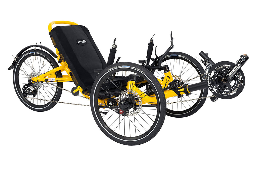 Catrike Trail recumbent trike in yellow, three-quarter view