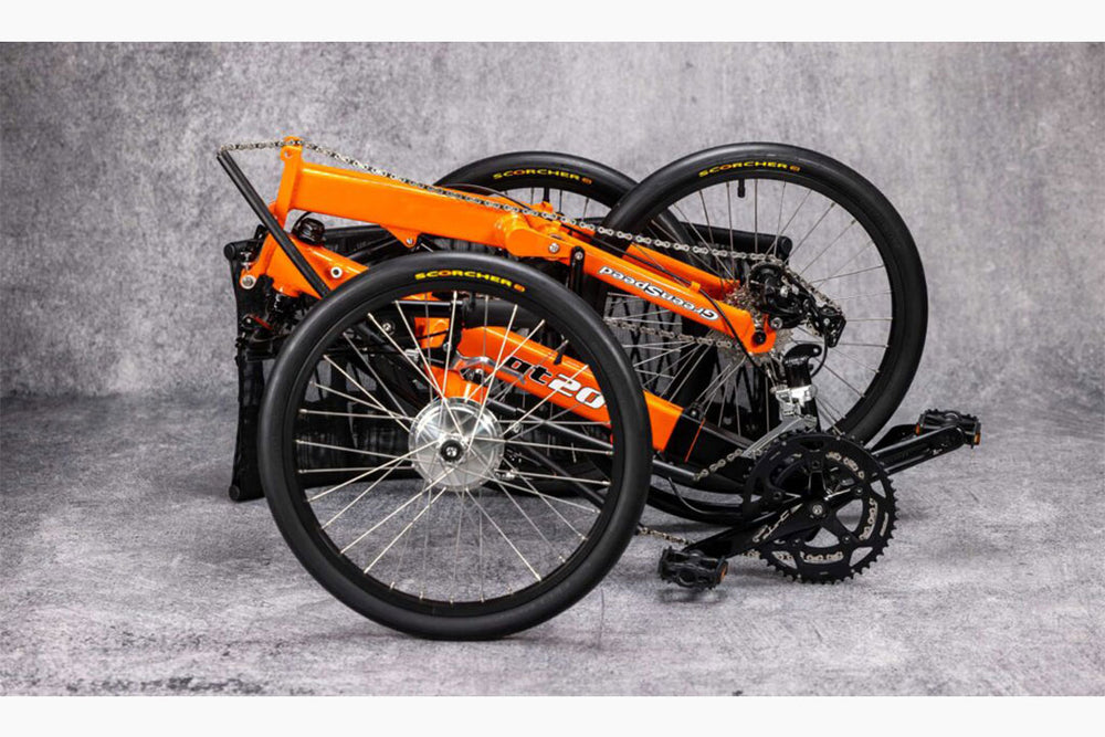 GreenSpeed GT20 RS orange recumbent trike folded for transport with wheels removed