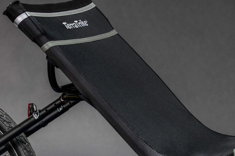 Wide chromoly-framed mesh seat on the TerraTrike Rogue e+ recumbent trike