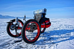 AZUB FAT recumbent trike with red anodized rims parked on the frozen Lake Baikal