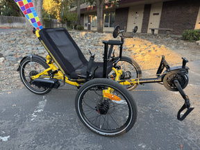 Demo Catrike MAX eCAT in Firefly Yellow, side view with Bosch motor and battery