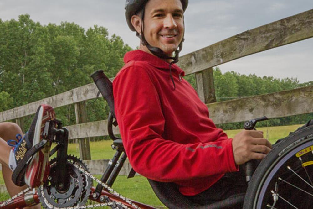 Two riders on a TerraTrike Tandem Pro recumbent tandem trike outdoors