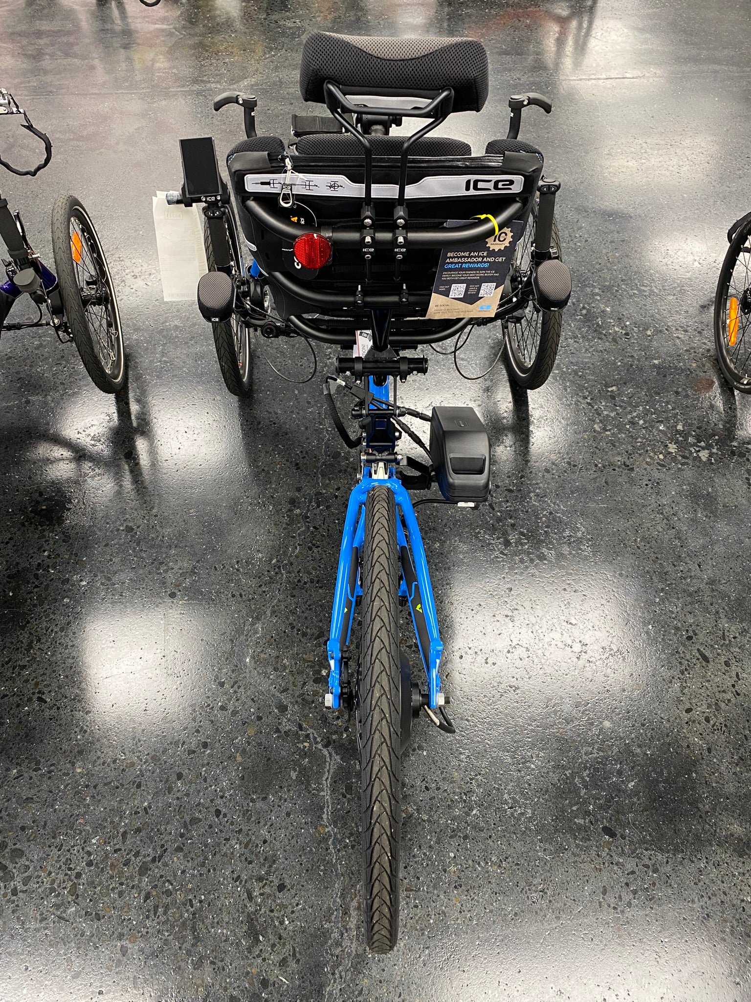 ICE Adventure PERS chainless trike in blue, rear view with battery and hub motor
