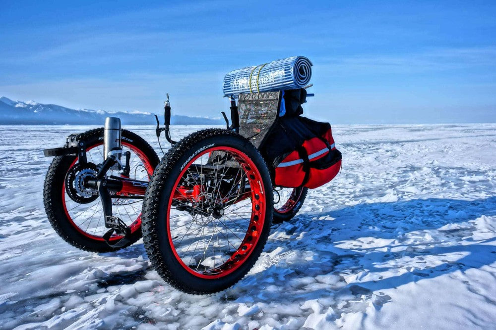 AZUB FAT recumbent trike with red anodized rims parked on frozen Lake Baikal