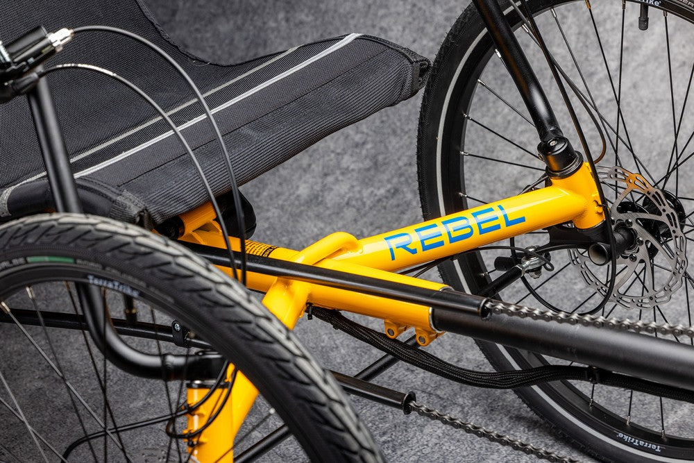 Wide outrigger frame and 24 inch wheel on the TerraTrike Rebel e+ recumbent trike