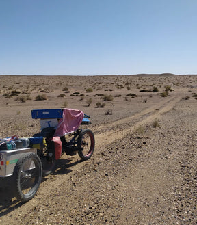 Rider on an AZUB FAT recumbent trike in the Mongolian desert